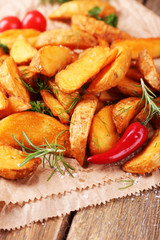 Homemade fried potato with spices and herbs