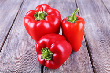 Red pepper on wooden background