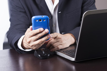 businessman working and holding smart phone