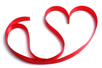 Heart shaped shiny red satin ribbon isolated on white