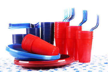 Bright plastic disposable tableware isolated on white