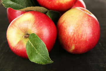 Ripe apples on wooden background