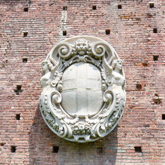 Bas-relief on the wall of Sforza castle in Milan, Italy.