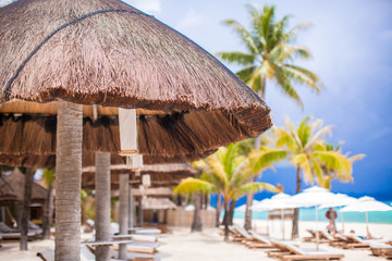 Beach wooden chairs for vacations on tropical beach