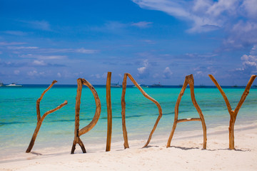 Friday made of wood on Boracay island background turquoise sea