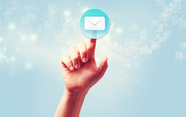 Hand pressing a envelope icon