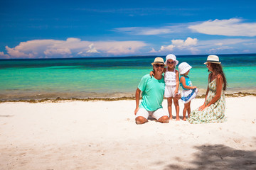 Family of four on beach vacation