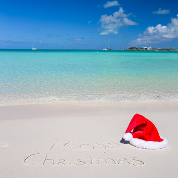 Merry Christmas written on tropical beach white sand with xmas