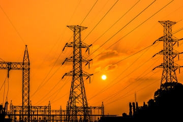 high voltage electric pillars on  sunset background  in thailand