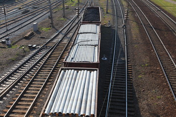 railroad tracks. wagons carrying cargo