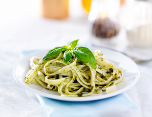 italian fettuccine in basil pesto sauce
