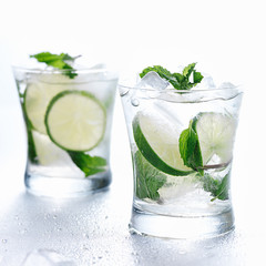 two mojito cocktails on background
