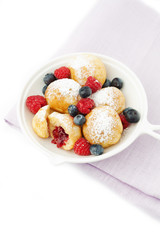 Traditional danish pancakes - ebelskivers with fresh berries