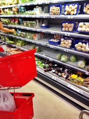Shelves with fresh vegetables at a supermarket in Romania