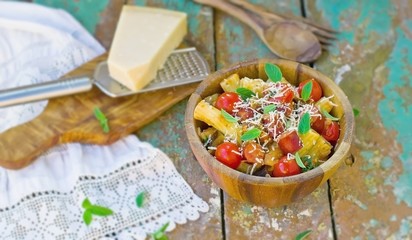 macaroni with vegetables, sausages and parmesan
