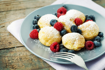 Traditional danish pancakes - ebelskivers with fresh berries