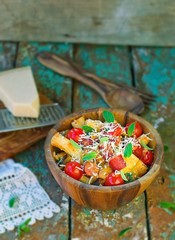 macaroni with vegetables, sausages and parmesan