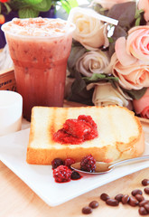 toast bread and sweet strawberry and berry jam in white dish bes