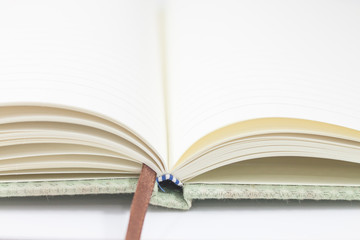 Closeup opened notebook on white background
