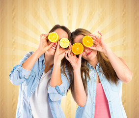 Girl playing with fruits over pop background