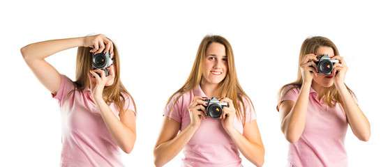 Girl taking a picture over white background