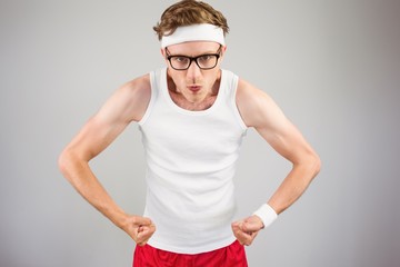 Geeky hipster posing in sportswear