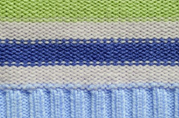 Knit woolen texture. Fabric striped background