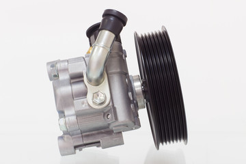 power steering pump on a gray background engine