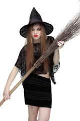 Girl in witch costume with a broom. 2