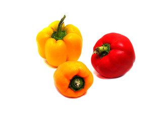 three ripe peppers on a white background