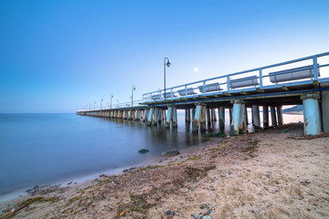 Fototapeta premium Baltic pier in Gdynia Orlowo at dusk, Poland