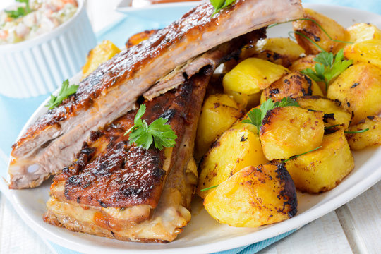 Beef ribs and baked potatoes