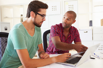 Businessmen Using Laptop In Office Of Start Up Business