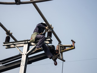 Workers setting up an electric sub station