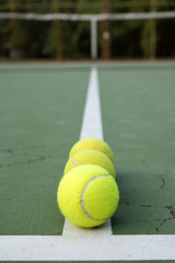 tennis ball on green court