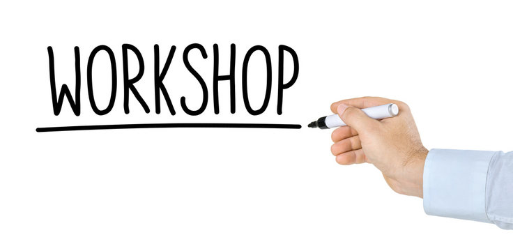 Hand mit Stift schreibt Workshop