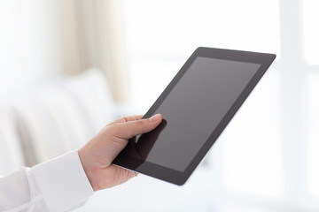 man holding tablet computer