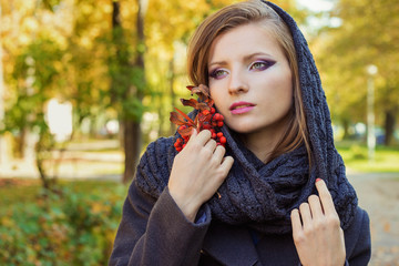 woman with Rowan in hand with the beautiful makeup with a scarf