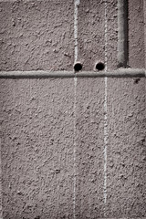 two holes in brick wall