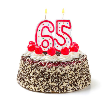 Geburtstagstorte mit brennender Kerze Nummer 65