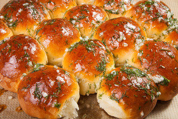 freshly baked rolls smeared garlic butter and dill