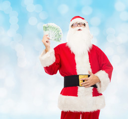 man in costume of santa claus with euro money