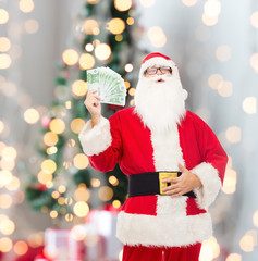 man in costume of santa claus with euro money