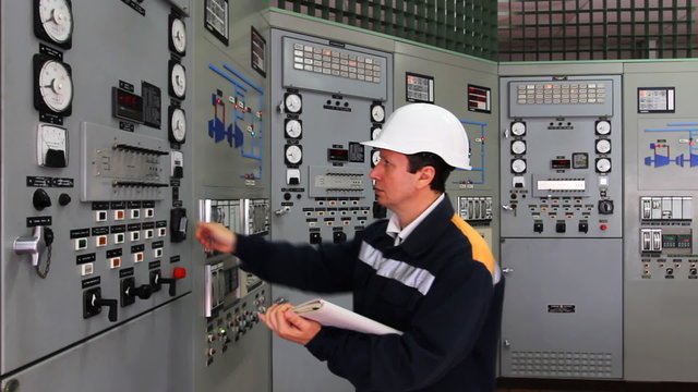 engineer looks and writes technical parameters