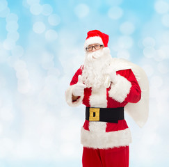 man in costume of santa claus with bag