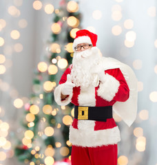 man in costume of santa claus with bag