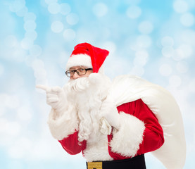 man in costume of santa claus with bag