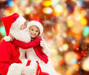 Fototapeta na wymiar smiling little girl with santa claus