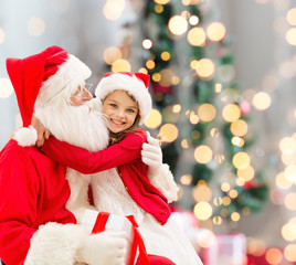 Fototapeta na wymiar smiling little girl with santa claus