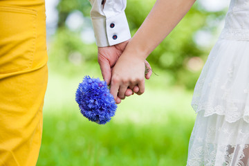 Couple holding hands